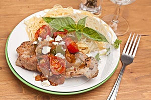 Pork chop with fresh tomato and Pasta