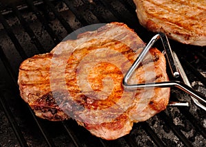 A Pork Chop on the grill photo