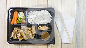 pork chop kurobuta steak Japanese style in bento set on plastic box