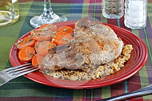 Pork chop, rice and carrot dinner.