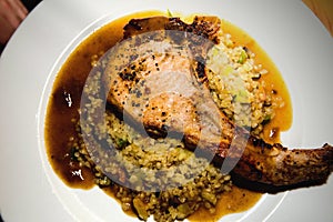 Pork chop with rice in plate