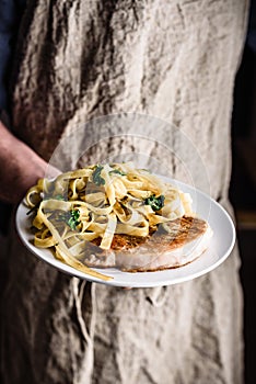 Pork chop steak and pasta with capers