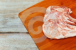 Pork chops on a cutting board. Selective focus