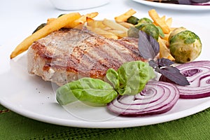 Pork chops with fries and brussels sprouts