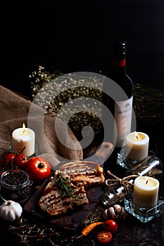 Pork chops steak with black pepper sauce placing on vintage wooden plate together