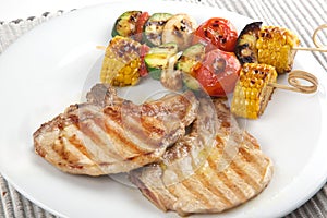 Pork chops with vegetables brochette