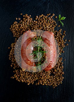 Pork cotechino with lentils on slate stone