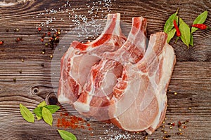 Pork cut meat chop with bay leaf and red pepper