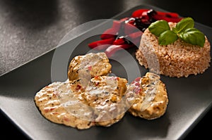 Pork fillets with rice and peppers.