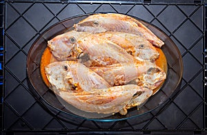 Pork fish or peroÃÂ¡ fish (Balistidae) cleaned on a plate on a dark background