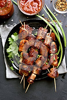 Pork kebabs on wooden skewers