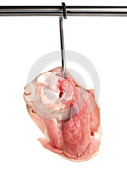 Fine Meat - Pork Knuckle - Hanging on a Meat Hook isolated on white Background