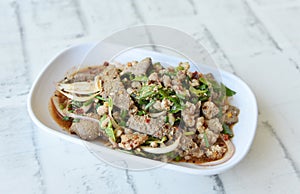 Pork liver spicy salad in white dish