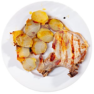 Pork loin chops served with potatoes