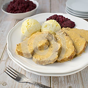 Pork loin in cream and horseradish sauce with potatoes and boiled beetroot salad.