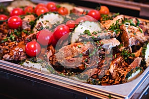 pork loin with vegetables, roast beef, served in a Brazilian restaurant or buffet, typical food for parties and social events,