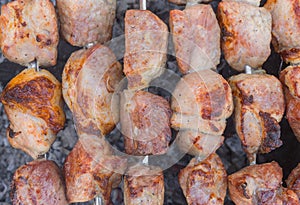 Pork meat cooked outdoor on smouldering carbons