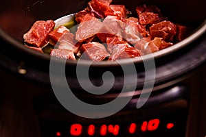 Pork meat preparing in a slow cooker