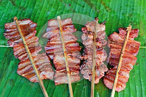 Pork meat skewer sold in an Asian street market stall