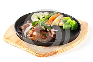 Pork neck grill isolated on black plate on white background