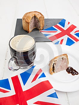 Pork pie and beer with flags