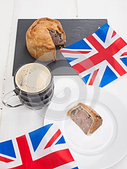 Pork pie and beer with flags