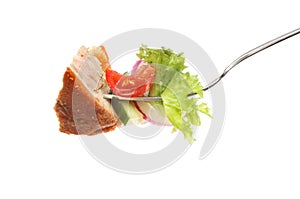 Pork pie and salad on a fork