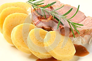 Pork with potato dumplings and white cabbage