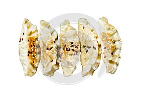 Pork Potstickers on rustic black table. Dim sum Isolated on white background. Top view.