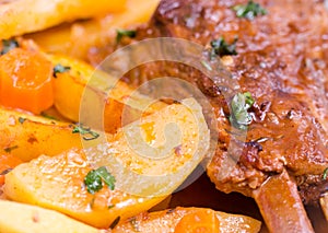Pork ribs and baked potatoes with parsley