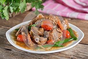 Pork ribs braised with soy sauce and vegetable.