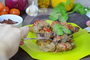 Pork ribs braised with soy sauce and vegetable tomato on the plate.