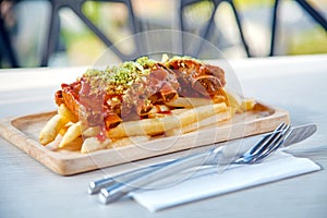 Pork ribs grill sauce with french fries on wood table