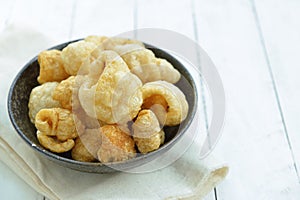 Pork rinds also known as chicharon or chicharrones, deep fried p
