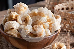 Pork rinds also known as chicharon or chicharrones , kab moo