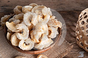 Pork rinds also known as chicharon or chicharrones , kab moo