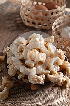 Pork rinds also known as chicharon or chicharrones , kab moo