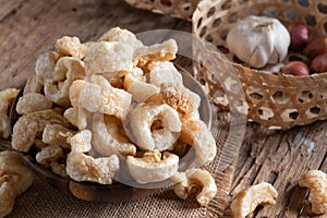 Pork rinds also known as chicharon or chicharrones , kab moo