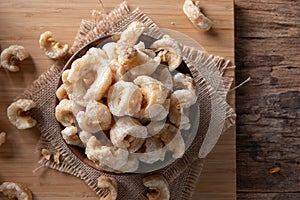 Pork rinds also known as chicharon or chicharrones , kab moo