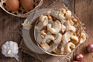 Pork rinds also known as chicharon or chicharrones , kab moo