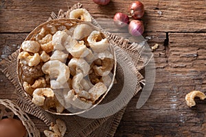 Pork rinds also known as chicharon or chicharrones , kab moo