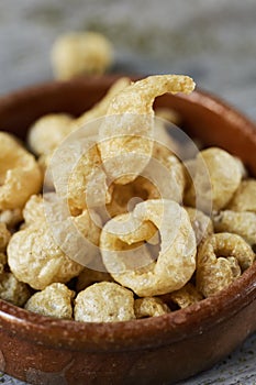 Pork rinds in an earthenware bowl