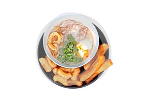 Pork`s Rice porridge served with deep-fried dough stick.