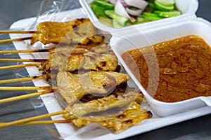 Pork satay, Thai street food grilled pork served with peanut sauce  and sour sauce