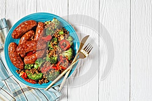 Pork sausages with lentils, top view, copy space