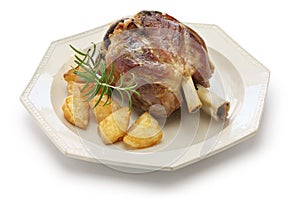 Pork shank with roasted potatoes, italian cuisine photo