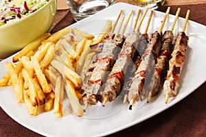 Pork skewers with french fries