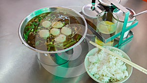 Pork soup in hot pot with rice