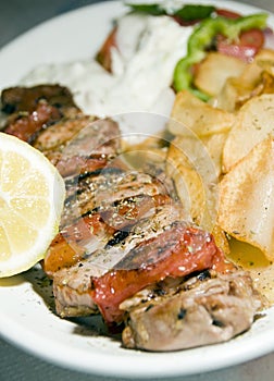 Pork souvlaki with tzatziki taverna food Greece