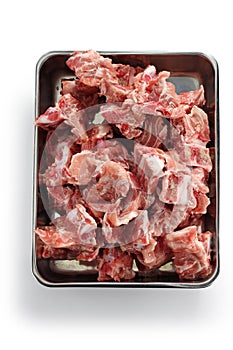 Pork spine on butcher tray